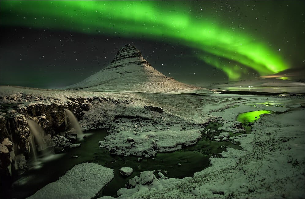 Kirkjufell bathed in the northern lights. Photo by Martin Schulz