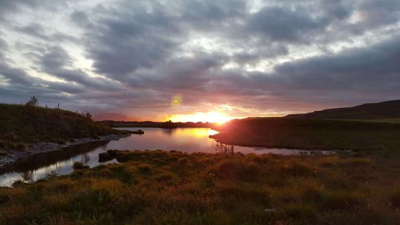 Icelandic summer symphony. This photo shows a small lake in Iceland during night.