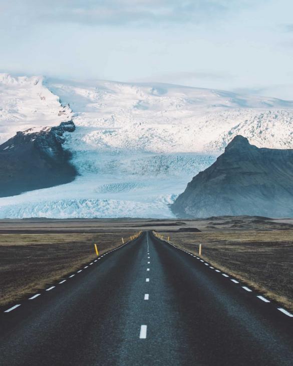 On the road in Iceland. The mighty Vatnajökull glacier provides a stunning background to your road in Iceland.