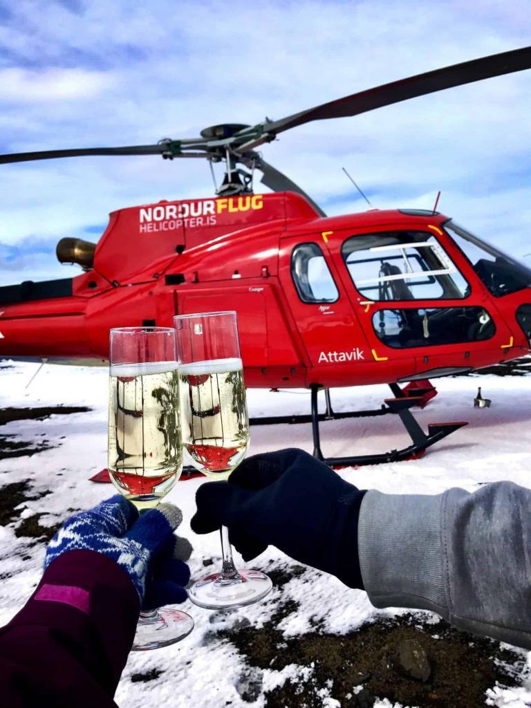 People toasting on a Reykjavik Helicopter tour.