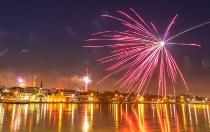 Reykjavik is illuminated by fireworks on New Year's Eve.