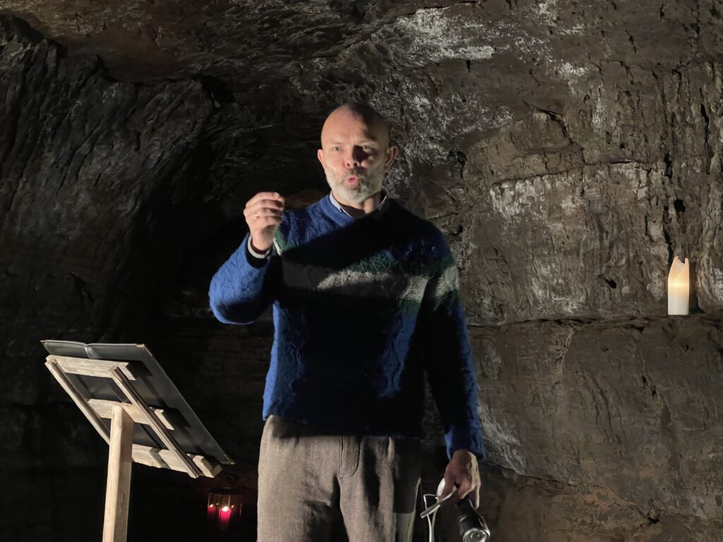 Professor Baldur Thorhallson presents at the Caves of Hella.