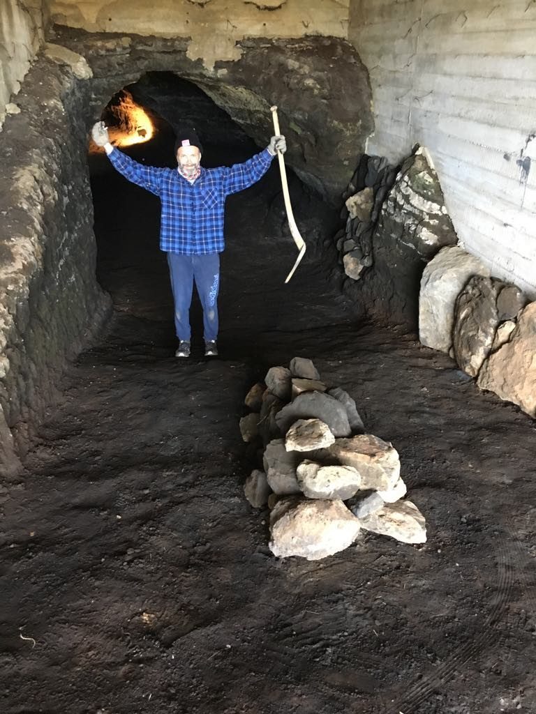 Baldur Thorhallsson inside a man made cave.