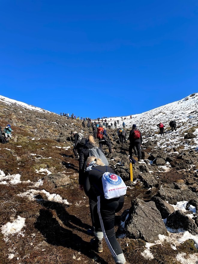 People hiking in Iceland to see a volcano