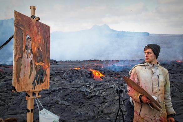 Artist Max Denison-Pender paints a volcano in Iceland.