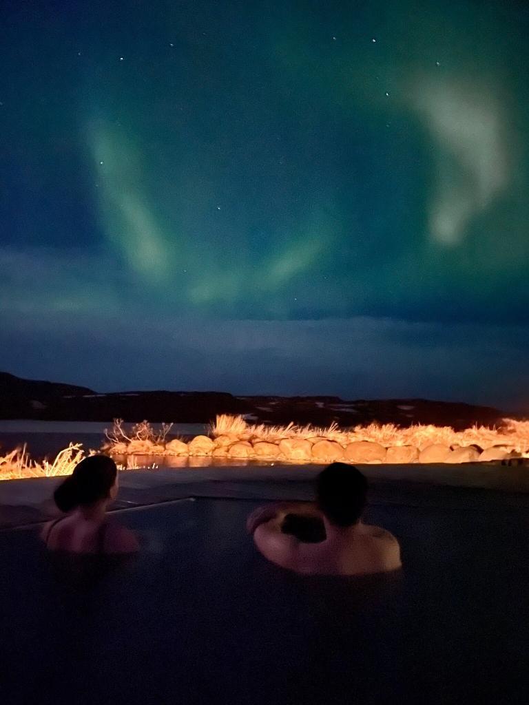 Northern lights in winter at Vök baths