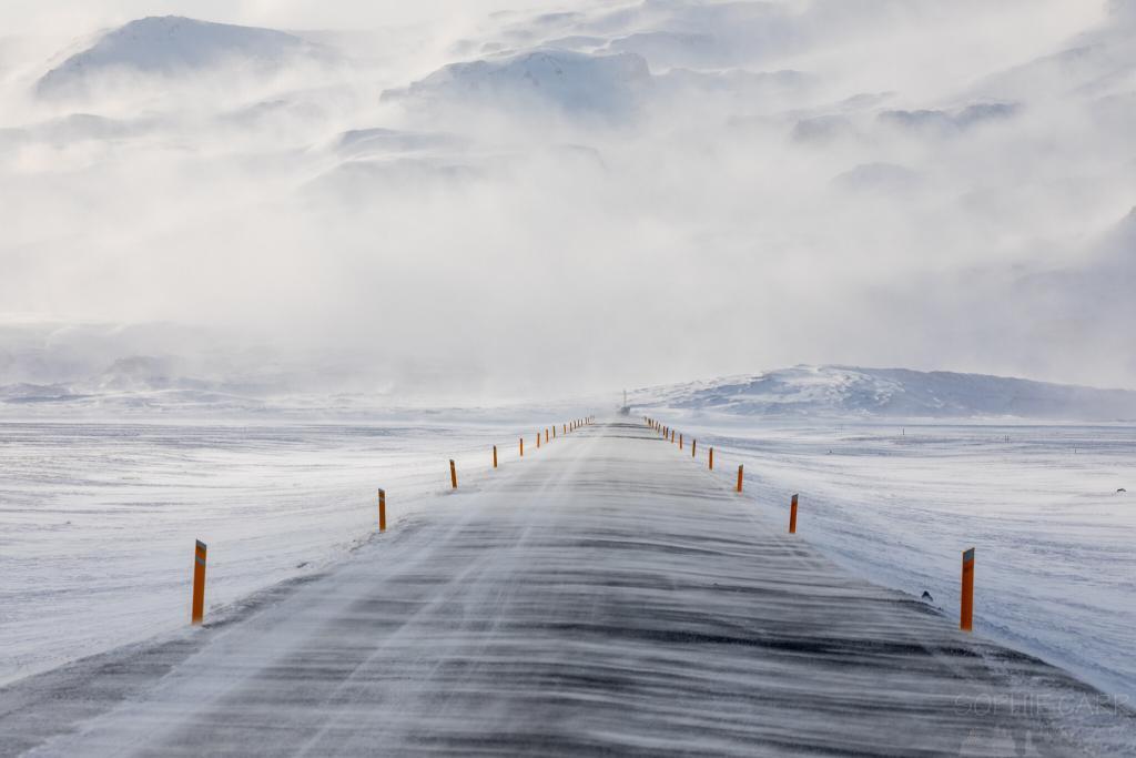 Snow blows over the road near Fjallsárlón glacial lagoon.