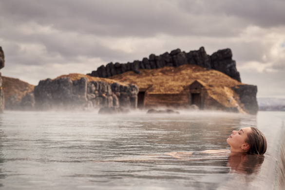 Woman lying in the Sky Lagoon in Iceland