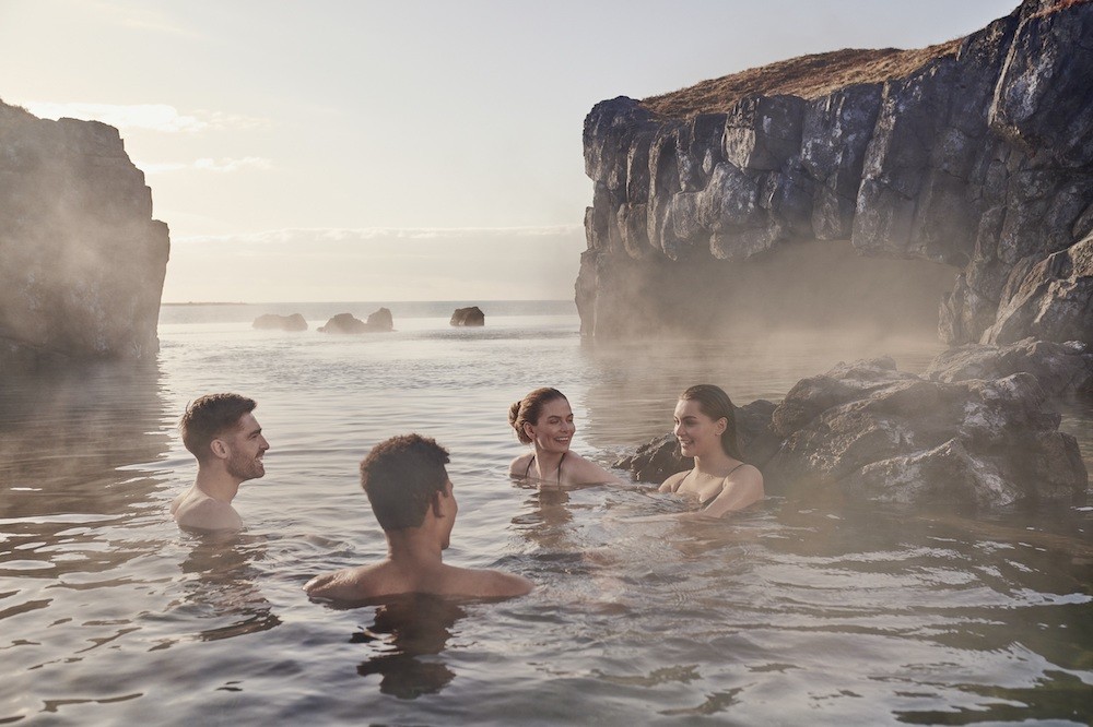 People in the Sky Lagoon spa in Iceland.