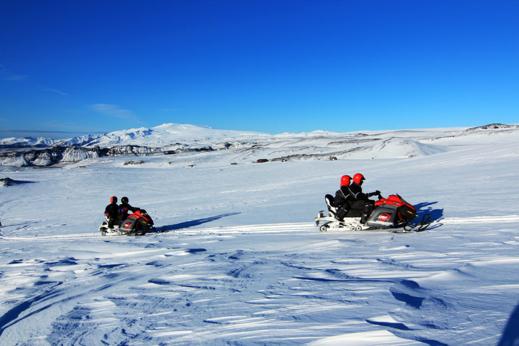 people on snowmobiles in Iceland.