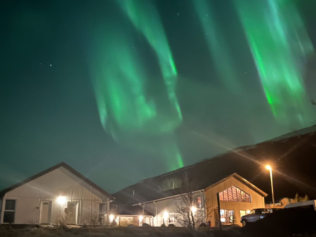 Northern lights over Heydalur hotel