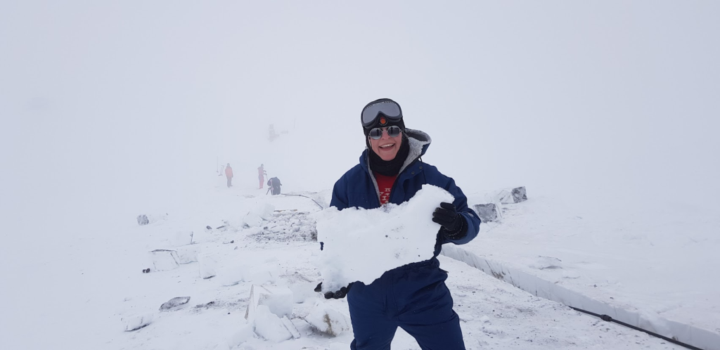 Woman with a chunk of ice in Iceland.