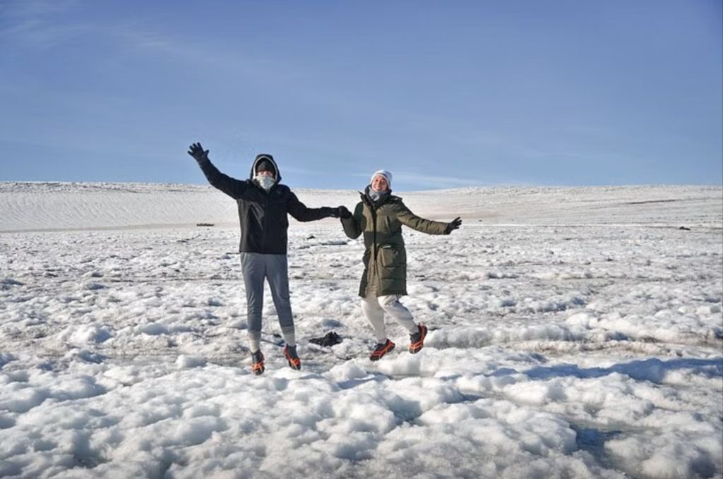 Man and woman at Langjökull glacier in Iceland.