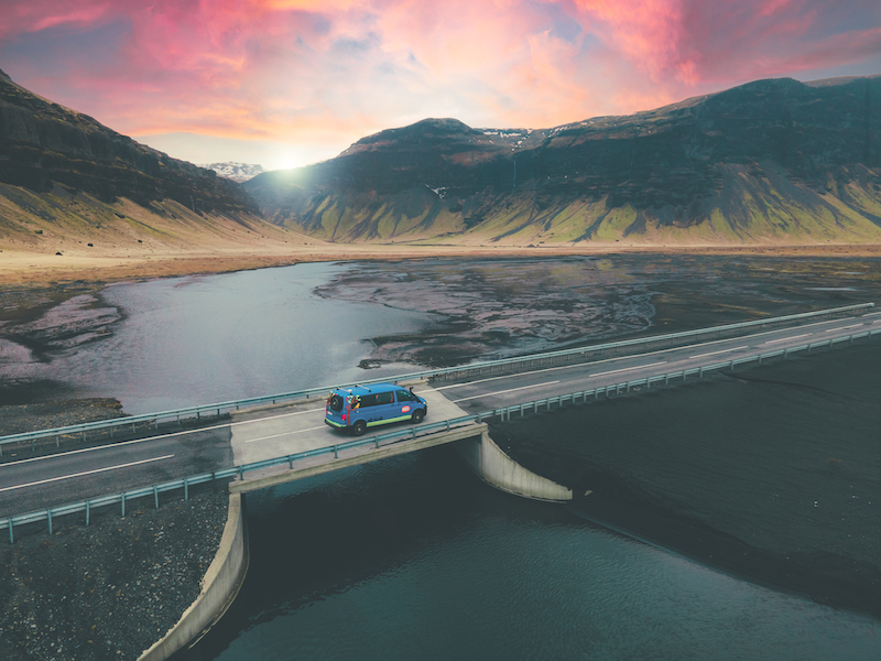 A camper van crosses a bridge in Iceland.