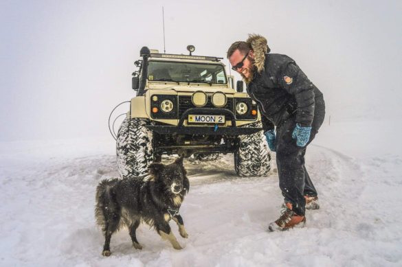 The dog Cami, a Land Rover, and Bessi Jonsson who is an Icelandic guide.
