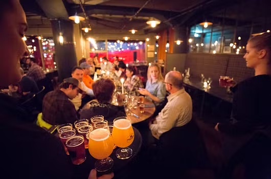 Crowd of people in Reykjavik enjoying beer