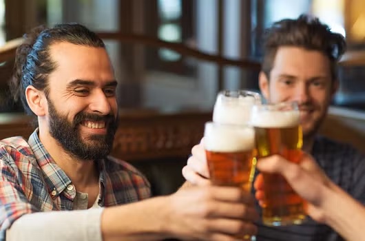 Men toasting with beer.