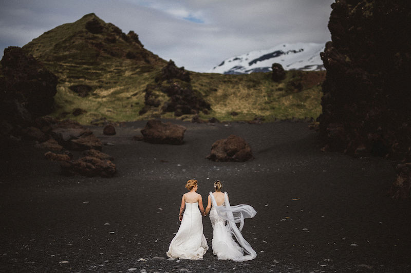 Two women in wedding dresses in Icelandic nature.