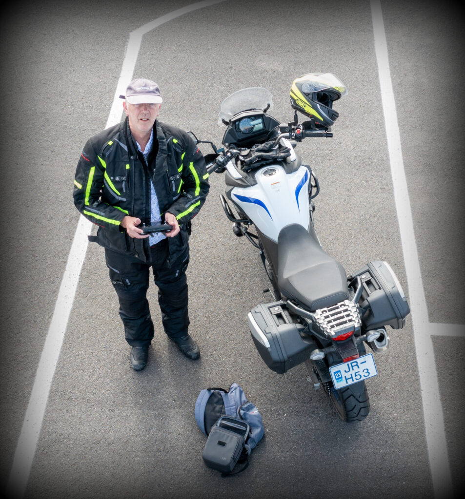 Motorcyclist Einar H. Reynis directs air traffic.