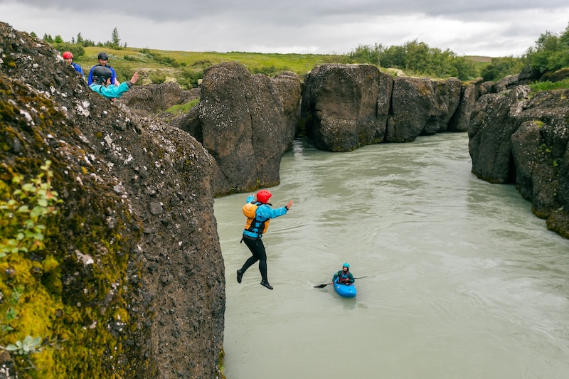 Jumping from a cliff under a watchful eye of a safety kayaking. This is so much fun!