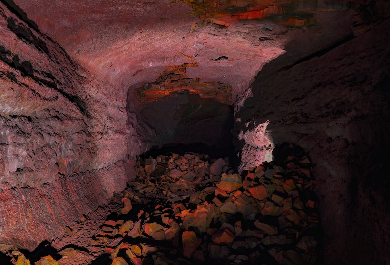 Víðgelmir lava cave in West Iceland, featuring illuminated volcanic rock walls and lava formations, the largest lava tube in Iceland and a highlight of the Silver Circle.