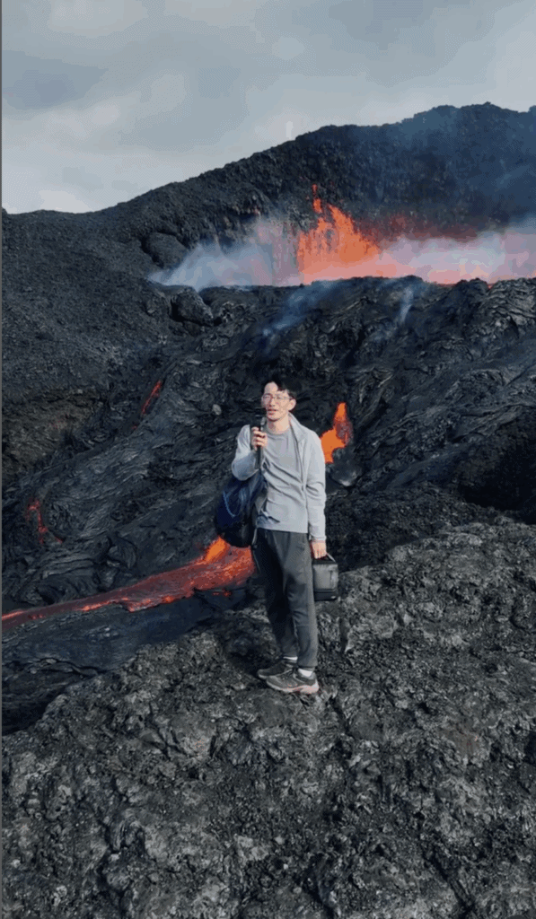 Man standing in a lava field. 