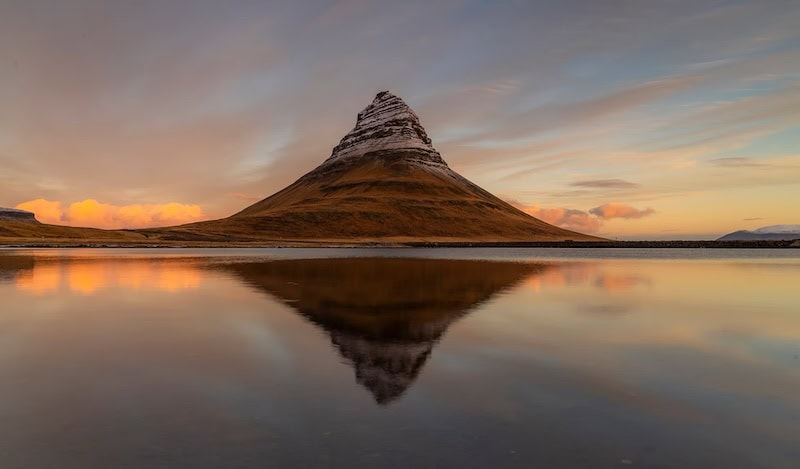 Golden hour magic at Kirkjufell—Kévin Pagès captures Iceland’s most iconic mountain in perfect stillness on the Snæfellsnes peninsula.
