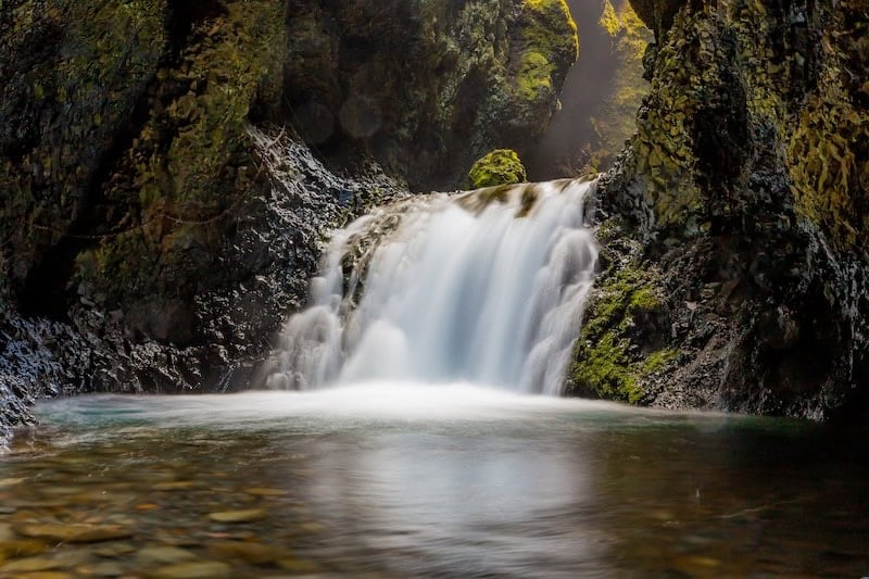 A hidden gem in South Iceland—Nauthúsagil waterfall cascades through a mossy canyon, offering a magical, off-the-beaten-path experience for adventurous hikers.
