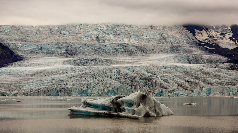 Sólheimajökull Glacier in South Iceland, with dramatic ice formations and glacial meltwater. A popular site for glacier hikes and climate change research.