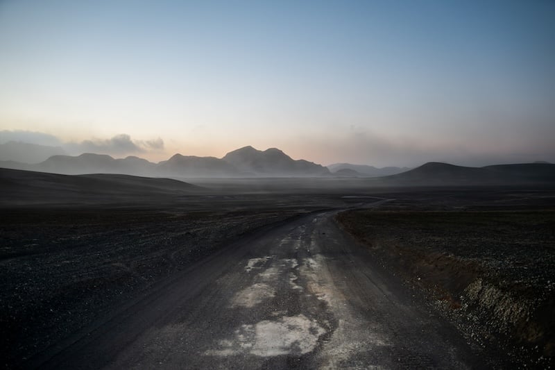 Iceland highlands gravel road through volcanic landscape at dawn - photography by Rico de Jong
