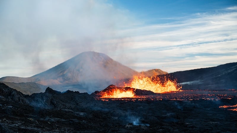 Reykjanes Peninsula volcanic eruption wide view with lava fountains and cone Iceland - Rico de Jong