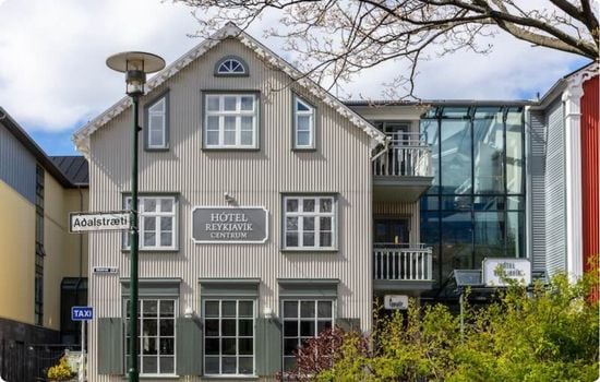 A boutique hotel building in central Reykjavík, Iceland, with traditional Nordic architecture and modern glass extensions.